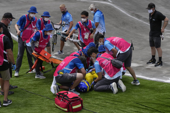 Saya Sakakibara of Australia is stretchered away by medics after crashing in the women’s BMX semi-finals at the Tokyo Olympics.
