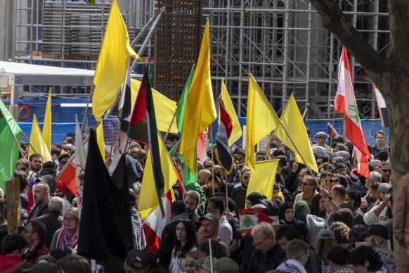 Yellow and green flags at the pro-Palestine rally in Melbourne.