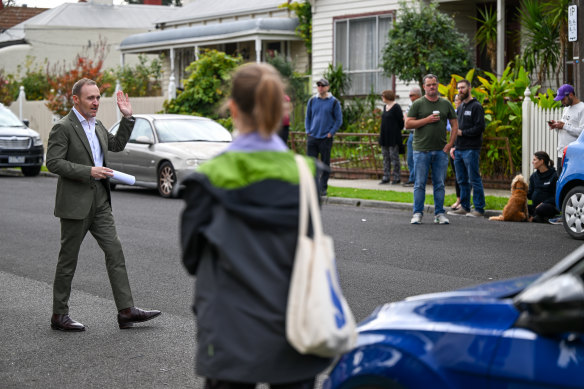 Jellis Craig Northcote auctioneer Nigel Harry calls for bids during the auction.