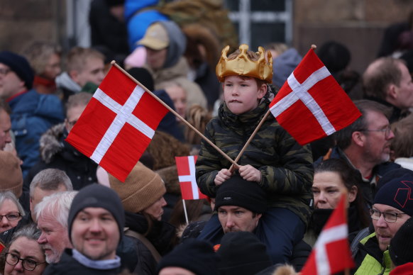 Royal fans wait to see the new king and queen.