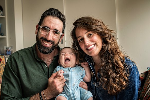 Dr Zac Seidler and wife Cassandra with their son, Artemis.