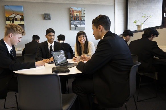 Ashfield Boys High senior study teacher Rachel Bennett with year 11 students.  