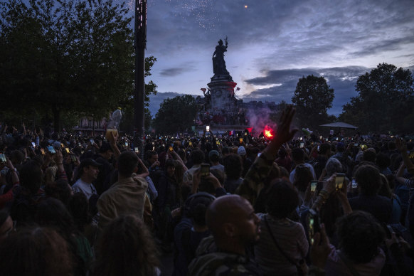 People celebrate at Place de La Republique after the second round of the legislative election.