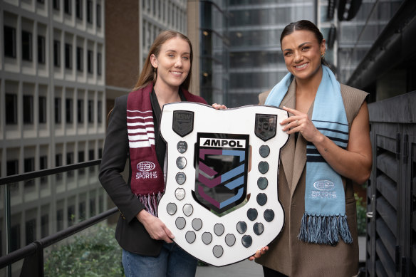 NRLW stars Tamika Upton (left) and Millie Elliott with the State of Origin shield.