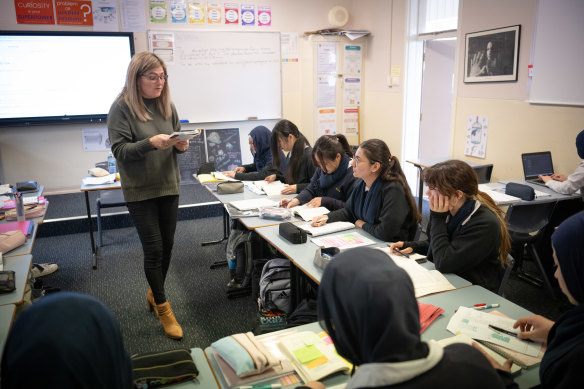 Students in an English advanced class at Birrong Girls High with teacher Robyn Caravas.