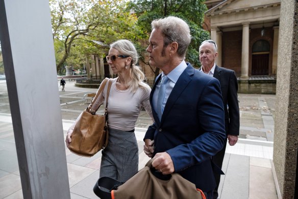 Craig McLachlan arrives at court with his wife Vanessa Scammell.