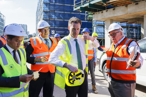 Better Regulation Minister
 Anoulack Chanthivong, NSW Premier Chris Minns and Building Commissioner David Chandler.