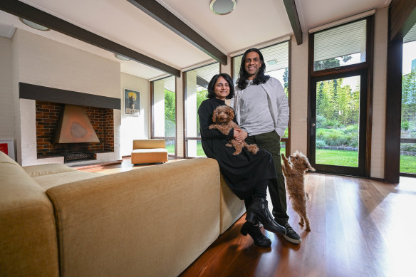 Onisha and Veeral Patel and their dogs, Cipo and Hachi, in their home, designed by mid-century architect Robin Boyd, which will be open to the public for the first time. 