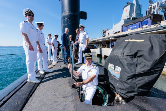 Rear Admiral Matthew Buckley of the Royal Australian Navy emerging from the USS Asheville, a Los-Angeles class nuclear-powered submarine on a visit to Western Australia in March last year.