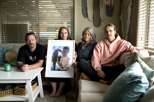 The Chater family – Ralph, Shayne, Stacey and Harry – with a photo of son and brother Brayden. 