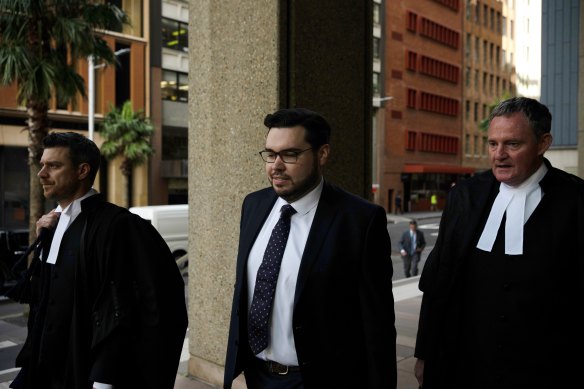 Bruce Lehrmann and his legal team outside the Federal Court in Sydney on Monday.