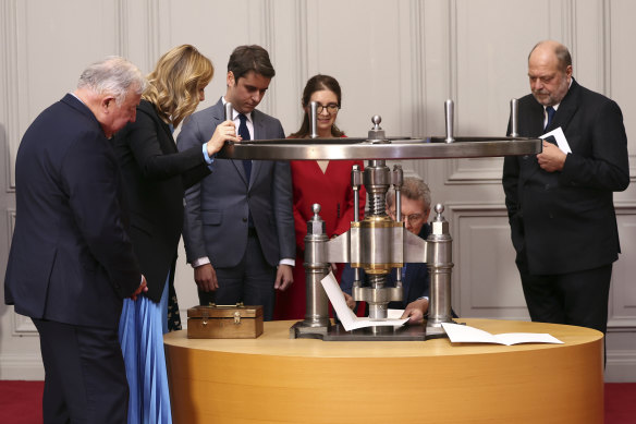 From left, Senate President Gerard Larcher, National Assembly President Yael Braun-Pivet, PM Gabriel Attal, Deputy Minister for Gender Equality Aurore Berge, and Justice Minister Eric Dupond-Moretti witness the seal of the abortion right article 34 into the Constitution at the Palace of Versailles.