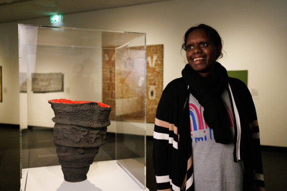 Artist Josina Pumani pictured with her work Maralinga.