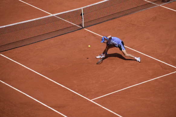 Alex de Minaur plays a shot.