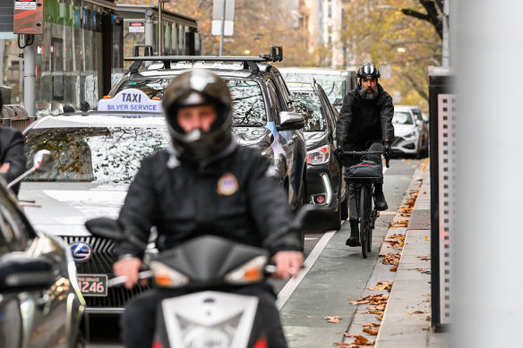 A cyclist riding on the top end of Collins Street.