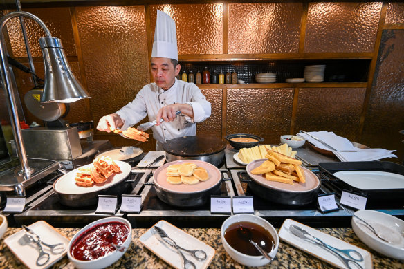 Chef David How prepares breakfast buffet items at Melba, The Langham Melbourne’s restaurant.