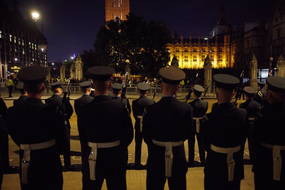 Soldiers stand in formation in front of the Houses of Parliament during a rehearsal on September 15, 2022 for Queen Elizabeth II’s funeral.