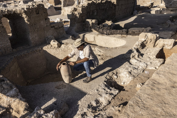 Avshalom Davidesko from Israel’s Antiquities Authority examines a jar in the ancient winemaking complex south of Tel Aviv.