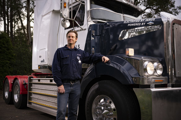 Bevan Dooley, co-founder of Janus Electric, with a fully electric Western Star truck.