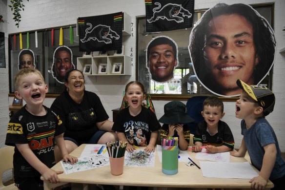 Vanessa Harris and young fans Brody, 4, and three-year-olds Mila, Ashton, James and Alex colour in fan art at the Penrith Early Learning Centre. 