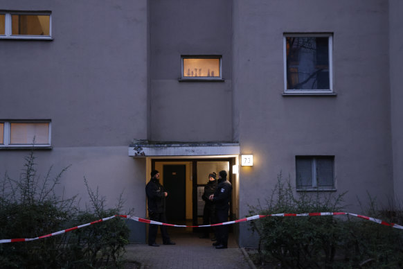 Police stand at the entrance to an apartment building following the arrest of long-sought after RAF terrorist and robber Daniela Klette in Berlin, Germany. 