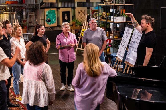 Songwriter Eddie Perfect helps <i>Space 22</i> participants including Vivienne and Ray write their own song.