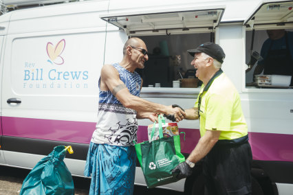 The Rev Bill Crews Foundation food van manager and driver Tony Farrell, serving up lunch and grocery drops to those in need at the Lethbridge Park Community Centre, December 7.