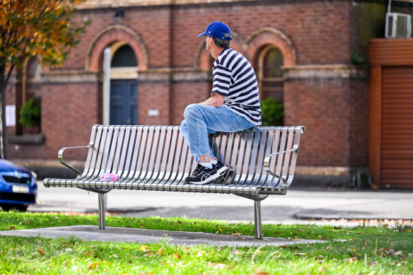 The old-school metal bench nearby is also being measured for its usage.