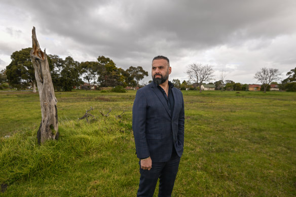 Hume City Council’s Sam Misho stands on the site of a former primary school in Broadmeadows where construction on social housing has stalled.