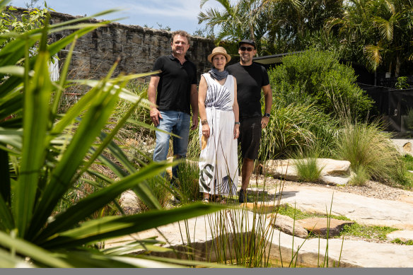Architect Clinton Cole (left) with owners of Holocene House, Karin Mundsperger and Jurgen Spangl, in the rear garden of the home.