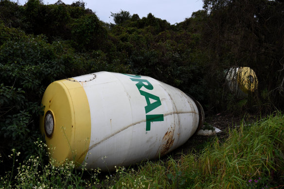 Two Boral cement mixers are left high and dry amongst cane near the township of Woodburn in the Richmond River region, washed up after the Lismore floods. 
