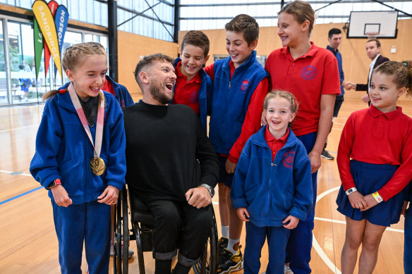 Dylan Alcott, with kids from Port Melbourne Primary School where the Victorian premier announced extra support for students with a disability.
