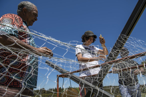 Newton Carriage teaches Bradley Carriage and Newton Bond how to weave a fishing net. 