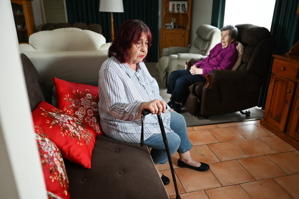 Anna Peretic, who lives with  her mother Franca, fell on the footpath outside a church in 2022 – and is still waiting for shoulder and hip replacement surgery.