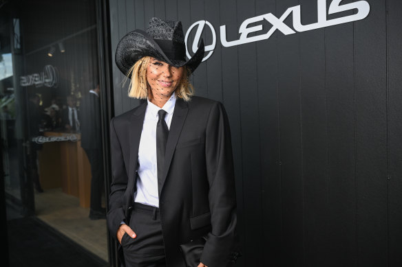 Pip Edwards in Giorgio Armani and a Nerida Winter hat at the Lexus marquee on Derby Day.