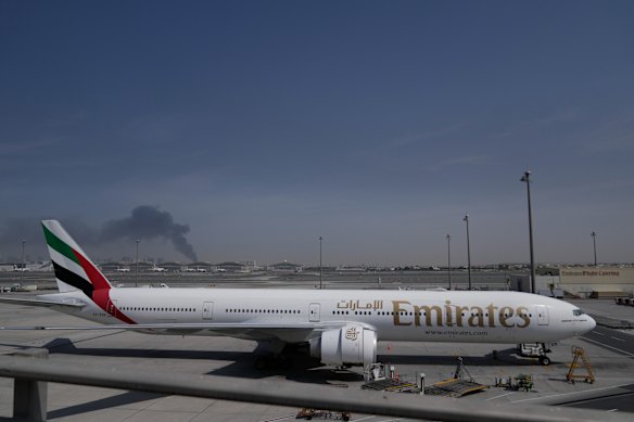 Smoke billows from an airstrike near Dubai International Airport, which has been closed since Sunday.