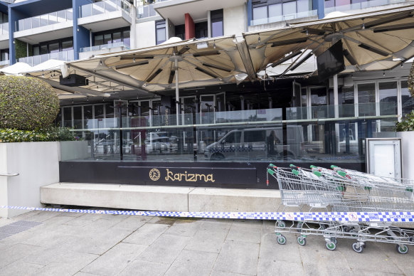 Police at the scene of Karizma Restaurant in Docklands which was targeted in a suspected arson attack overnight.