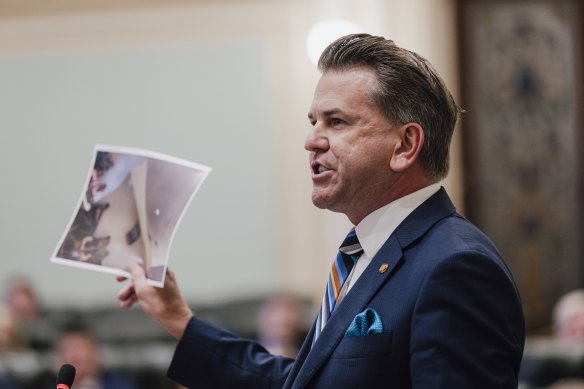 Deputy Premier Jarrod Bleijie tables photos purporting to show former premier Steven Miles drinking red wine at Townsville Airport. 