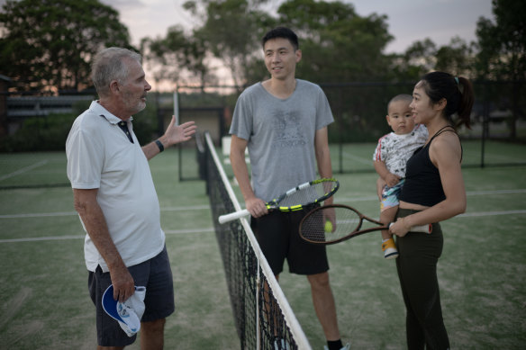 Former Longueville Tennis Club president Bruce Hogan with local players Will and Christina Hong, and young Alfred.