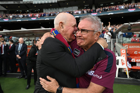 Leigh Matthews and Chris Fagan embrace moments after the final siren.