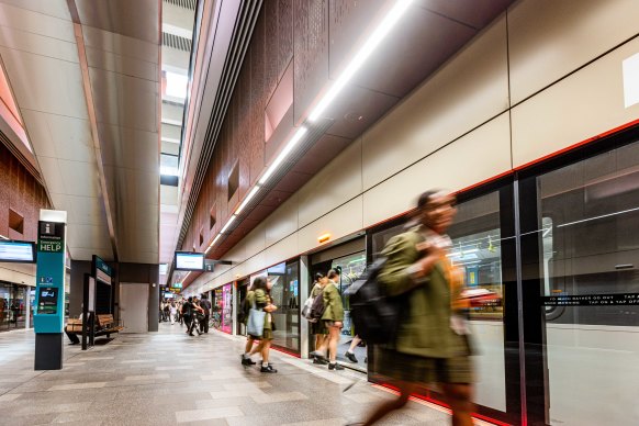 Commuters board a driverless train at Castle Hill station on the Metro Northwest line.