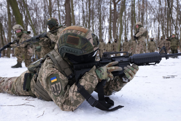 Civilian participants in a Kyiv Territorial Defence unit train in a forest near Kyiv anticipating the Russian invasion.