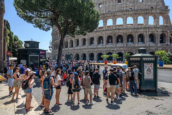 Tourists queue for water outside the Colosseum in Rome during a heatwave last summer.