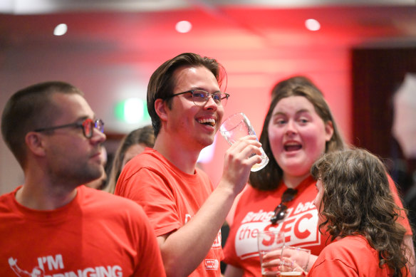Labor supporters start the celebrations of a likely victory at their party’s main election-night party in Daniel Andrews’ seat of Mulgrave.