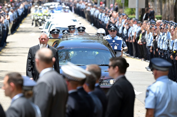 Constables Rachel McCrow and Matthew Arnold are given a guard of honour in Brisbane.