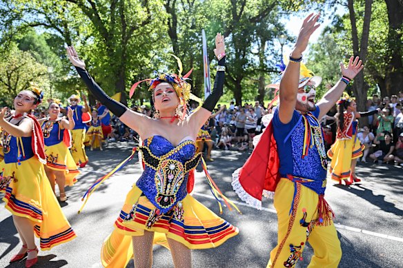 Colour and movement: Yayo Miranda, right, and fellow Colombia Dance Au trouple members dance in the 2025 Moomba parade.