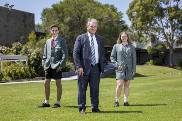 Eltham College principal Simon Le Plastrier and students Darcy Wenn and Emily Barker. Mr Plastrier says parents are pragmatic about COVID this year.