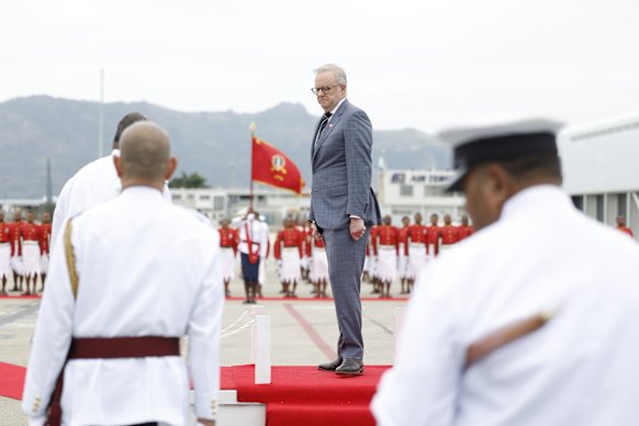 Albanese walks from the dais in front of the guard of honour in Nadi.