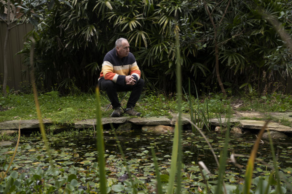 Mark Avery by one of the ponds in his backyard, which provide a habitat for frogs.