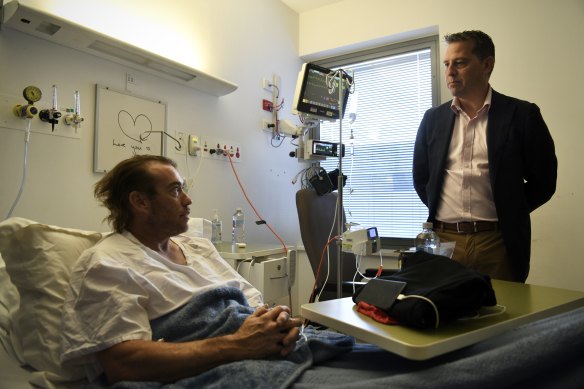 Health Minister Ryan Park meets heart attack survivor Tim Gorton  at Liverpool Hospital on Sunday.